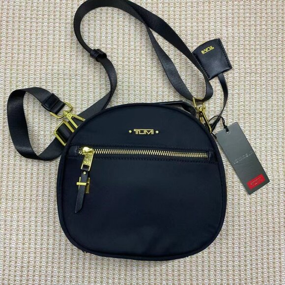 Tumi Handbags - TUMI Voyageur Women's Compact Round Crossbody Bag